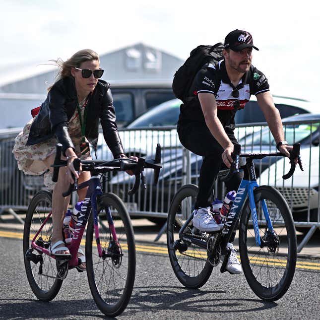 A photo of Valtteri Bottas and Tiffany Cromwell riding bikes. 