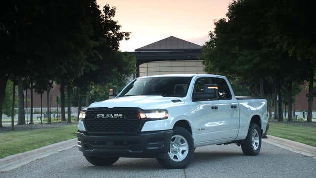 a white Ram 1500 from the front three quarters angle