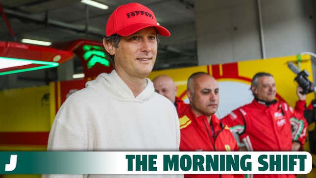 A photo of the chair of Ferrari and Stellantis in a WEC pit garage. 