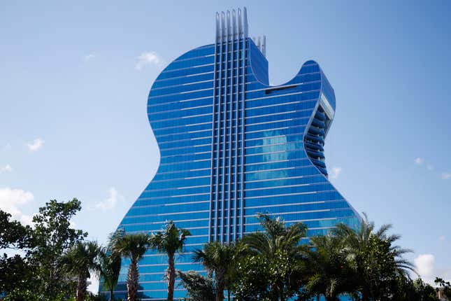 FILE - The guitar shaped hotel is seen at the Seminole Hard Rock Hotel and Casino on Thursday, Oct. 24, 2019, in Hollywood, Fla. The state of Florida and the Seminole Tribe of Florida will be raking in hundreds of millions of dollars from online sports betting this decade, thanks to a compact between the tribe and Gov. Ron DeSantis that gave the tribe exclusive rights to run sports wagers as well as casino gambling on its reservations. (AP Photo/Brynn Anderson, File)