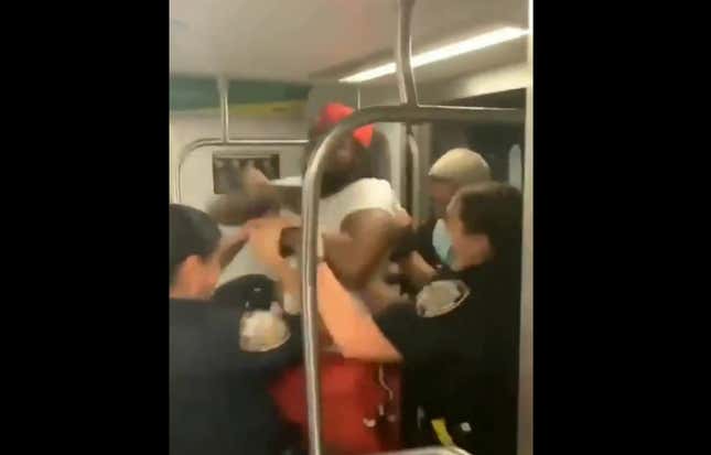 Image for article titled NYPD Officers Swarm and Tase Black Man on Subway After Accusing Him of Letting Someone on Without Paying Fare