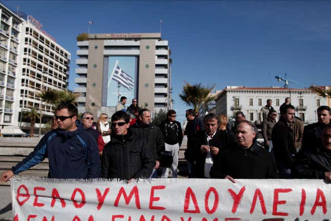 Greek shipyard workers protest at Omonia Square in central Athens with a plea: ” We want work.”