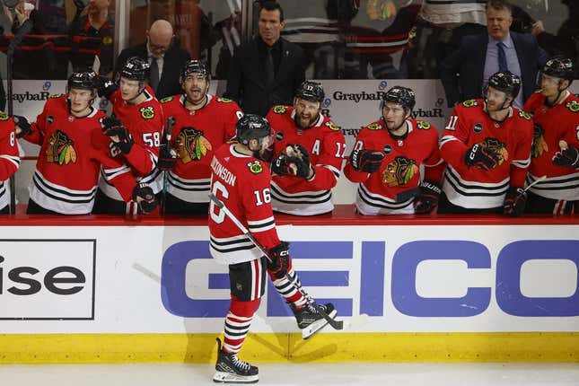 Mar 26, 2024; Chicago, Illinois, USA; Chicago Blackhawks center Jason Dickinson (16) celebrates with teammates after scoring against the Calgary Flames during the third period at United Center.