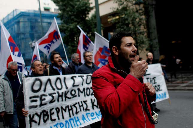 Union members affiliated with the Communist party march in solidarity with striking public transport workers in Athens.