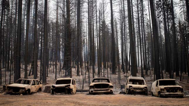 Scorched cars rest on a property on Winding Way in Grizzly Flats, California, located less than 40 miles from South Lake Tahoe.