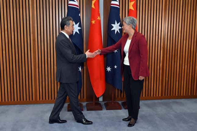 China&#39;s Foreign Minister Wang Yi, left, meets with Australia&#39;s Minister for Foreign Affairs Penny Wong at Parliament House in Canberra, Wednesday, March 20, 2024. Wang met his counterpart as part of a high-ranking diplomatic tour of Australia and New Zealand this week. (Mick Tsikas/AAP Image via AP)