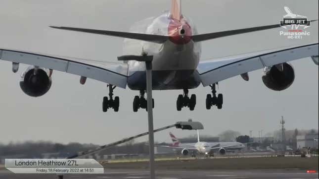 An enormous passenger jet coming in to land at Heathrow in high winds.