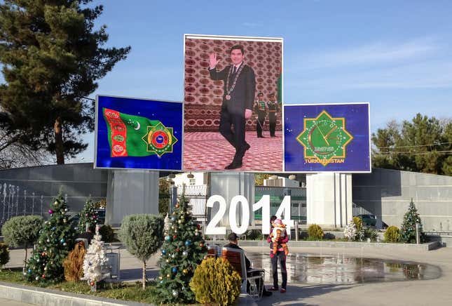 People rest in front of screens showing Turkmenistan's President Kurbanguly Berdymukhamedov (C) and the national symbols in Ashgabat December 13, 2013. Berdymukhamedov says Sunday's parliametary election is a democratic milestone for his gas-rich nation, but critics say it merely slaps a veneer on what they call a repressive autocracy.