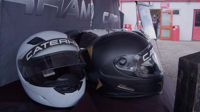 Picture of a pile of Caterham helmets. 