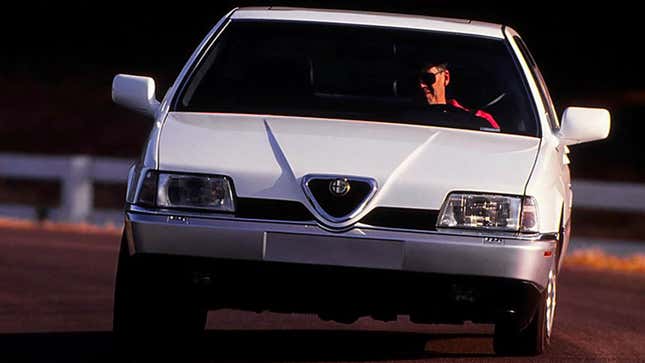 A white Alfa Romeo 164 LS