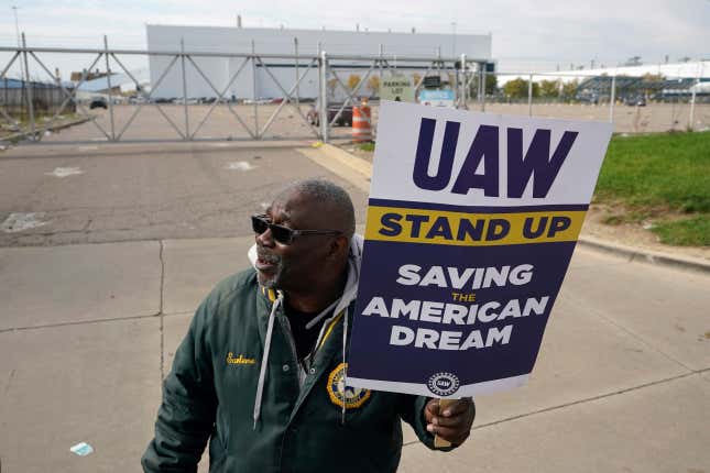 Dave Ratliff, a United Auto Workers member, walks the picket line during a strike at the Stellantis Sterling Heights Assembly Plant, in Sterling Heights, Mich., Monday, Oct. 23, 2023. (AP Photo/Paul Sancya)