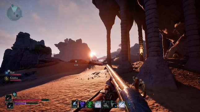 The protagonist of Avowed looks out at a setting sun in a desert environment while wielding a rifle.