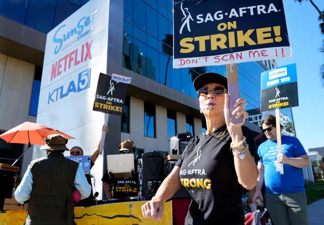 Striking SAG-AFTRA member Karen Brown participates in a picket line outside Netflix studios, Wednesday, Nov. 8, 2023, in Los Angeles. (AP Photo/Chris Pizzello)