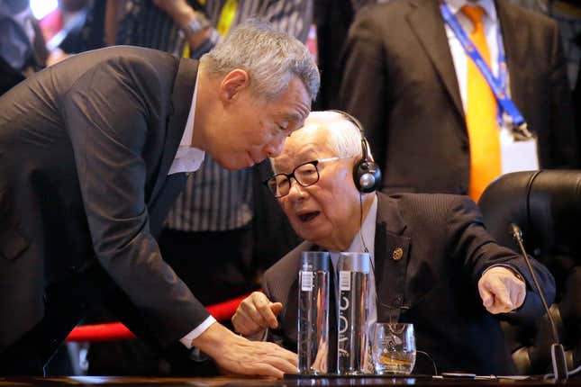 FILE - Singapore&#39;s Prime Minister Lee Hsien Loong, left, and Taiwan&#39;s special APEC representative Morris Chang talk before an International Monetary Fund (IMF) informal dialogue session at APEC Haus in Port Moresby, Papua New Guinea, on Nov. 18, 2018. Taiwan will take part in the Asia-Pacific Economic Cooperation forum in San Francisco this week, a rare opportunity for the self-governing island democracy of 23 million people and its high-tech economy to break the diplomatic embargo on it imposed by authoritarian China. Taiwan will represented by a civilian rather than a government figure or head of state, under an unwritten rule that satisfies China&#39;s contention that members of the organization participate as economic entities rather than state players. For the seventh time, Taiwan will be represented by Morris Chang, the 92-year-old founder of the world-leading Taiwan Semiconductor Manufacturing Company. (AP Photo/Mark Schiefelbein, File)