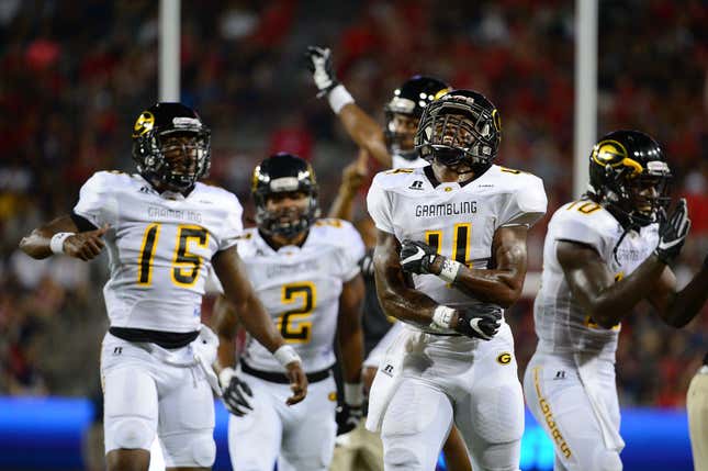 Wide receiver Martez Carter #4 of the Grambling State Tigers celebrates with teammates after scoring a touchdown against the Arizona Wildcats in the second quarter at Arizona Stadium. 