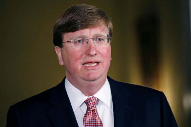 Mississippi Republican Gov. Tate Reeves delivers a televised address before signing a bill retiring the last state flag with the Confederate battle emblem during a ceremony at the Governor’s Mansion in Jackson, Mississippi, on June 30, 2020. Upon signing the bill, the flag loses its official status. - Lawmakers in Mississippi voted on June 28 to remove the Confederate battle standard from the state flag, after nationwide protests drew renewed attention to symbols of the United States’ racist past. The measure passed with a 91-23 majority vote in the House of Representatives, triggering cheers in the Senate gallery. A few hours later, the Senate voted 37-14 for the bill. 