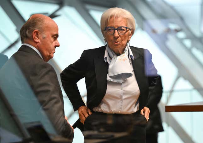 Christine Lagarde, right, President of the European Central Bank (ECB), arrives for a press conference together with Vice President Luis de Guindos, left, at the ECB headquarters in Frankfurt, Germany, Thursday, April 11, 2024. The European Central Bank is leaving its key interest rate benchmark unchanged, choosing to wait for confirmation that rapidly receding inflation is firmly under control before cutting rates to support an economy that’s struggling to grow. (Arne Dedert/dpa via AP)