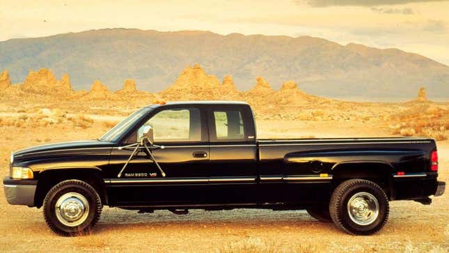 A side view of a black dually dodge ram 3500