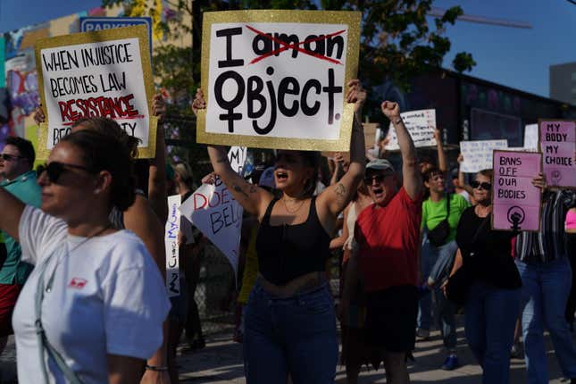 People march together to protest the Supreme Court’s decision in the Dobbs v Jackson Women’s Health case on June 24, 2022 in Miami, Florida.