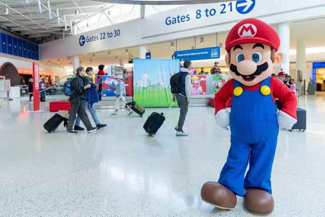 A photo of someone dressed as Mario at John F. Kennedy International Airport's Jetblue terminal.