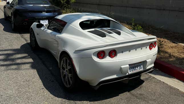 Rear 3/4 view of a white 2011 Lotus Elise SC