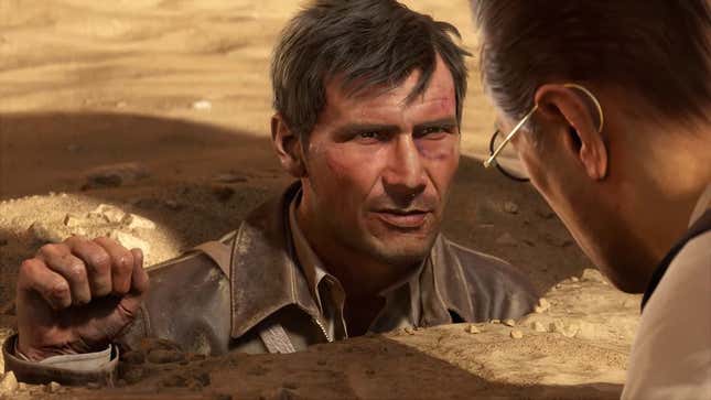 Indiana Jones is buried in sand up to his shoulders.