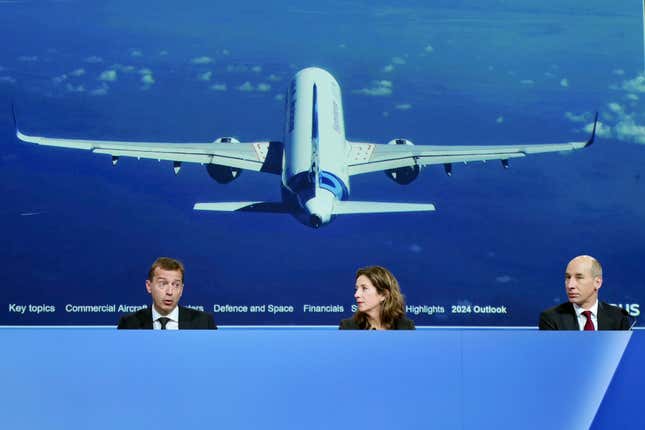 Airbus CEO Guillaume Faury, left, Chief Sustainability officer and Communications Julie Kitcher and Chief Finance Officer Thomas Toepfer present the European aerospace giant full year results, Thursday, Feb. 15, 2024 in Blagnac, near Toulouse, southwestern France. (AP Photo/Fred Scheiber)