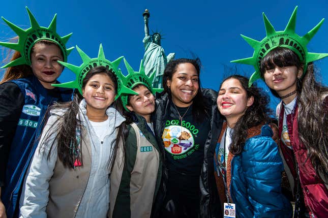 This photo provided by Girl Scouts of Greater New York shows Girl Scouts Troop 6000 paying a visit to the Statue of Liberty in New York in 2023. Troop 6000 has served kids who live in New York&#39;s shelter system since 2017, quietly welcoming hundreds of the city’s youngest new residents with the support of donations. (Kelly Marsh/Girl Scouts of Greater New York via AP)