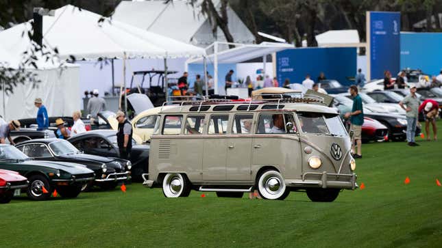 A photo of a beige VW Transporter bus. 