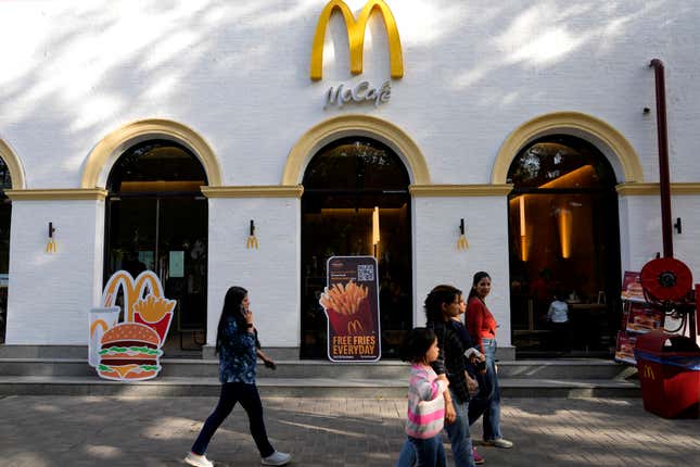 People walk past a McDonald&#39;s outlet in New Delhi, India, Friday, March 15, 2024. System failures at McDonald’s were reported worldwide Friday, shuttering some restaurants for hours and leading to social media complaints from customers, in what the fast food chain called a “technology outage” that was being fixed. (AP Photo/Manish Swarup)