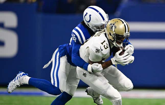 Oct 29, 2023; Indianapolis, Indiana, USA; Indianapolis Colts cornerback Tony Brown (38) tackles New Orleans Saints wide receiver Michael Thomas (13) during the first quarter at Lucas Oil Stadium.