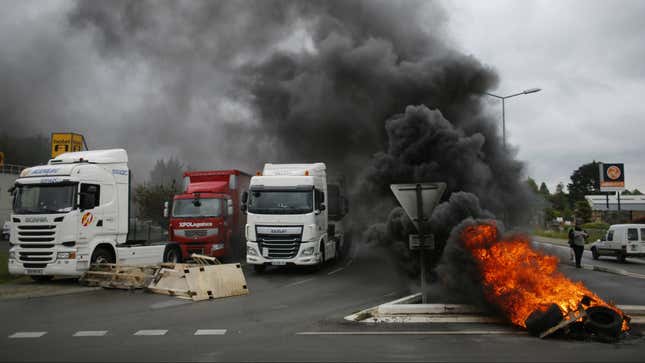 Striking French truckers stage a blockade near Nantes.
