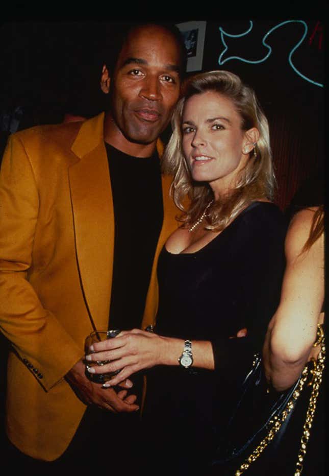 Portrait of American former foorball player OJ Simpson and his wife, Nicole Brown (1959 - 1994), as they attend a party at the Harley Davidson Cafe, New York, New York, 1993. 