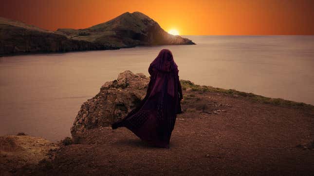 A promotional shot for The Acolyte, featuring a robed figure staring into the sunset.