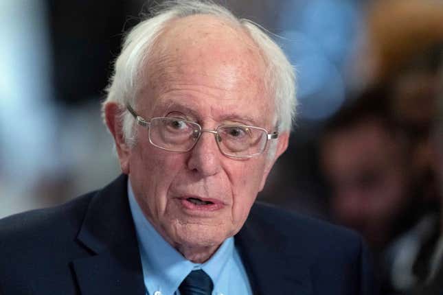 FILE - Sen. Bernie Sanders, I-Vt., talks to the media as he walks to the House chamber before President Joe Biden&#39;s State of the Union address at the U.S. Capitol, March 7, 2024, in Washington. Sanders, the far-left independent from Vermont, introduced a bill Thursday, March 14, that would shorten to 32 hours the amount of time many Americans can work each week before they&#39;re owed overtime. (AP Photo/Jose Luis Magana, File)