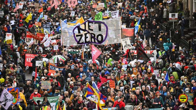 Climate protesters carrying signs and banners fill the streets at the Global Day of Action for Climate Justice march on November 6, 2021 in Glasgow, Scotland.