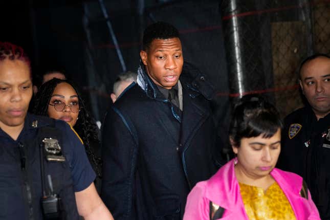 Jonathan Majors, third from left, leaves a courtroom in New York, Monday, Dec. 18, 2023. Majors was convicted of assaulting his former girlfriend during a confrontation in New York City earlier this year. A Manhattan jury convicted the Marvel star Monday of one misdemeanor assault charge and one harassment violation. (AP Photo/Seth Wenig)