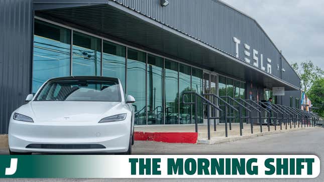 A photo of a Tesla Model 3 EV outside a dealership. 