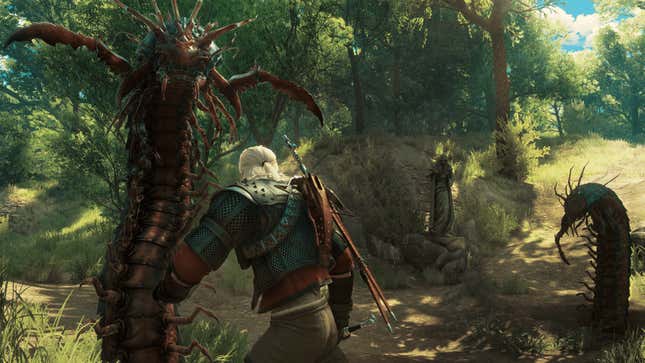 Geralt of Rivia in The Witcher 3: Wild Hunt, fighting a pair of giant centipedes. 