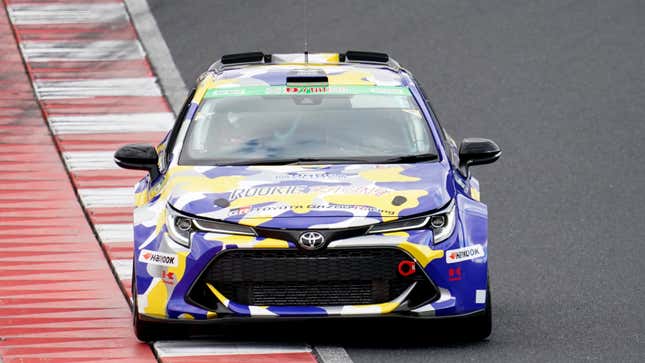 Akio Toyoda behind the wheel of a hydrogen-powered car in 2001. 