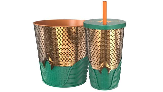 A popcorn bucket and soda cup styled in the gold and green colors of Aquaman's costume.