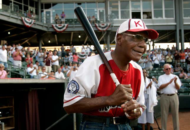 Buck O’Neil walks to the field as he is introduced before a minor league all-star game Tuesday, July 18, 2006, in Kansas City, Kan. 