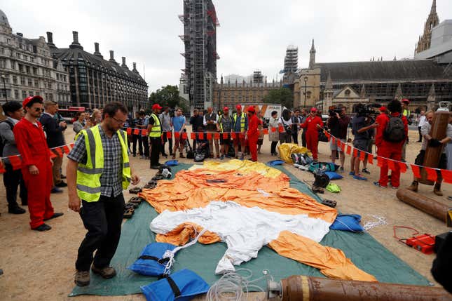 Demonstrators prepare to inflate a blimp portraying U.S. President Donald Trump, in Parliament Square, during the visit by Trump and First Lady Melania Trump in London