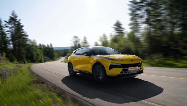 The 2024 Lotus Eletre S in Solar Yellow speeds along a Norwegian road.