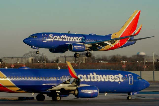 FILE - Southwest Airlines plane prepares to land at Midway International Airport, Feb. 12, 2023, in Chicago. Flight attendants at Southwest Airlines on Wednesday, April 24, 2024, ratified a contract that includes pay raises totaling more than 33% over four years, as airline workers continue to benefit from the industry&#39;s recovery since the pandemic. (AP Photo/Kiichiro Sato, File)