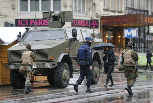Belgian soldiers and a police officer patrol in central Brussels, November 21, 2015, after security was tightened in Belgium following the fatal attacks in Paris. Belgium raised the alert status for its capital Brussels to the highest level on Saturday, shutting the metro and warning the public to avoid crowds because of a "serious and imminent" threat of an attack.
