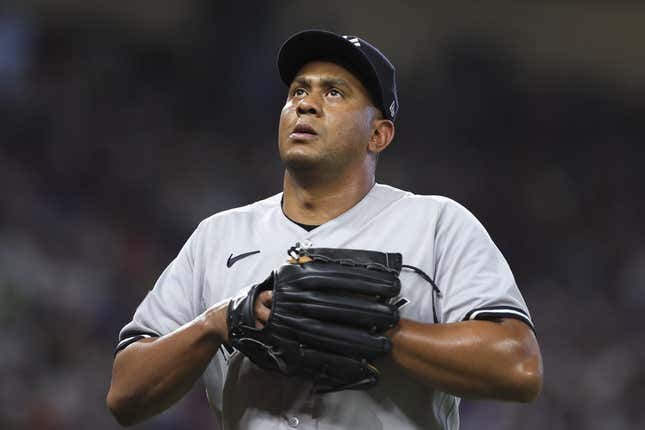 Aug 13, 2023; Miami, Florida, USA; New York Yankees relief pitcher Wandy Peralta (58) looks on as he leaves the game against the Miami Marlins during the eighth inning at loanDepot Park.