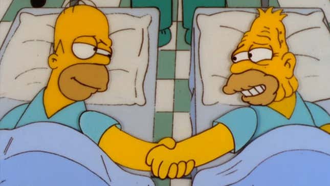 A screenshot from The Simpsons shows Homer and his dad holding hands in the hospital.