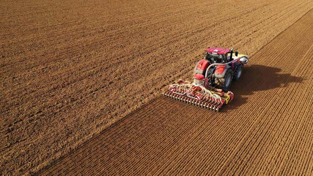 A farmer drives his tractor to sow wheat in his field in Havrincourt, France, October 26, 2022.