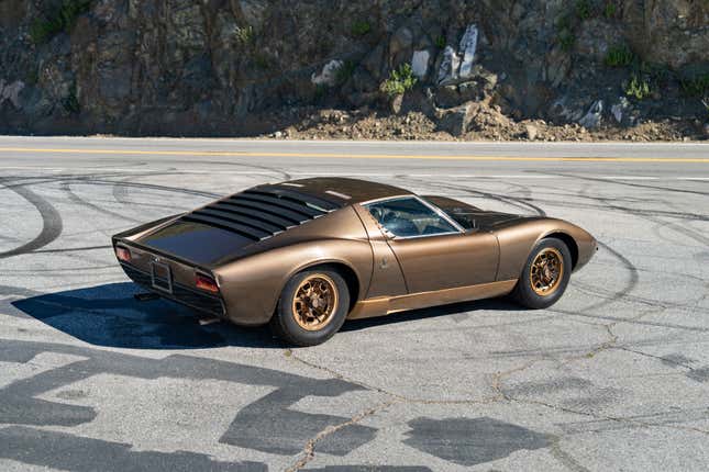 Rear 3/4 view of a brown Lamborghini Miura P400 S